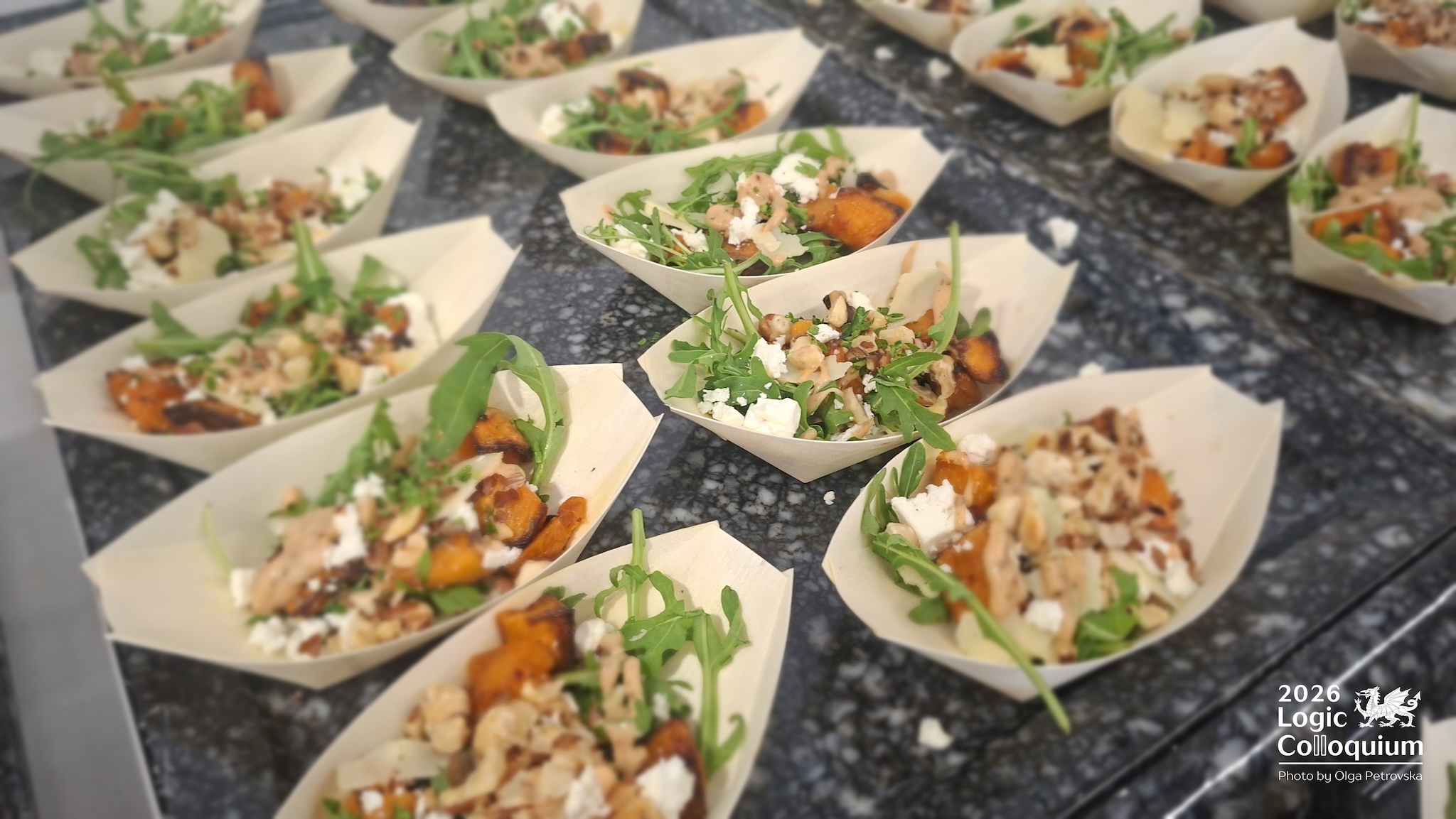 Photograph of some salad in little paper boats.