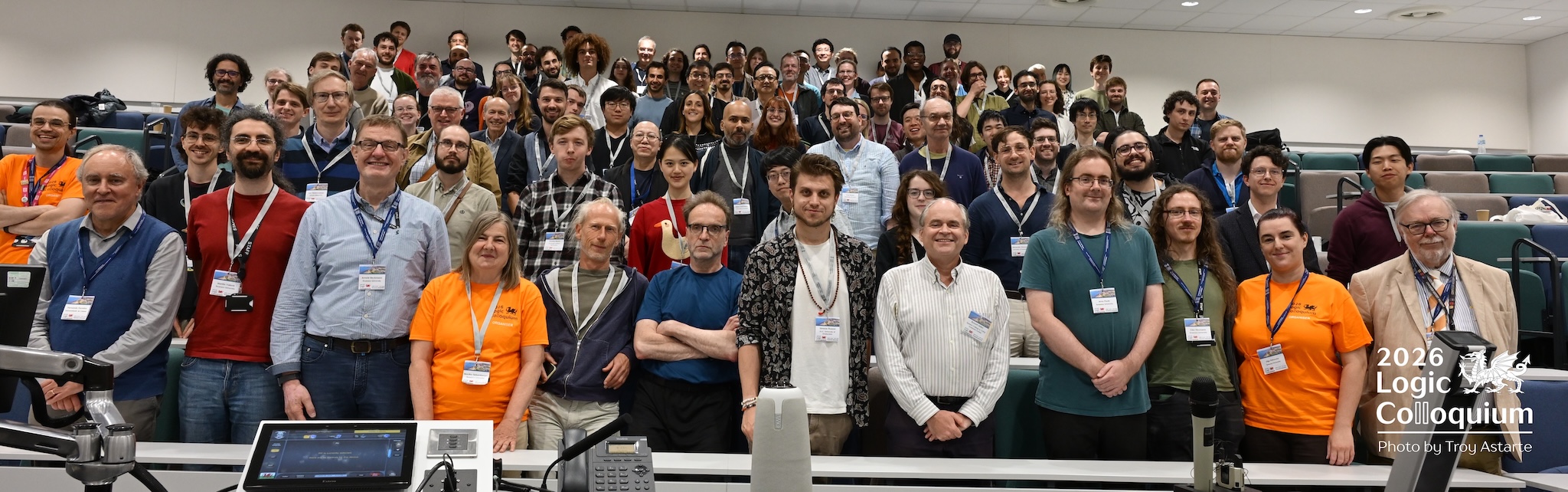 photograph interior of lecture theatre from the front with attendees arrayed in rows.